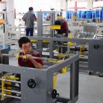 Máy dán thùng catton tự động